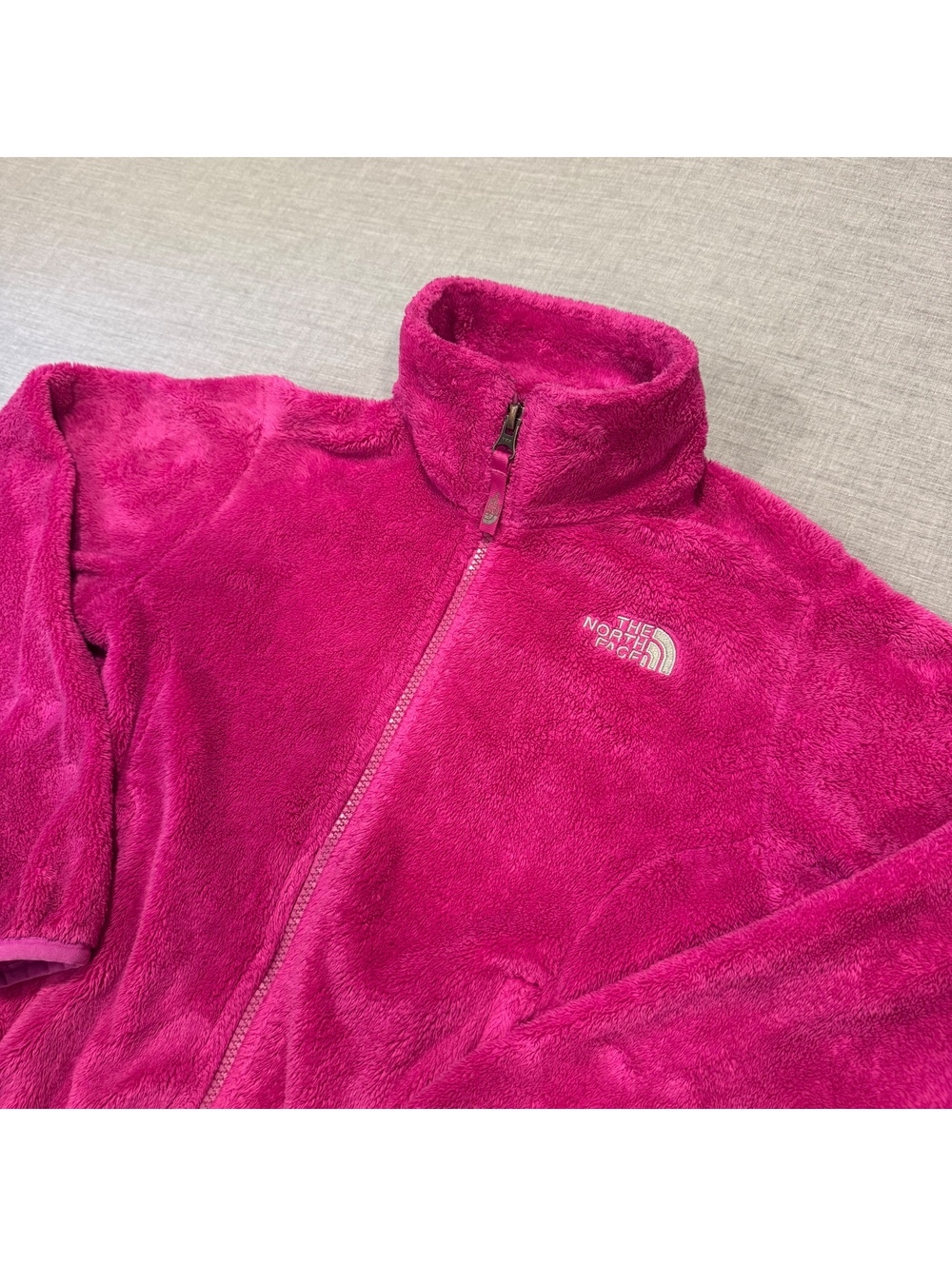 The North Face girls pink full zip fleece jacket